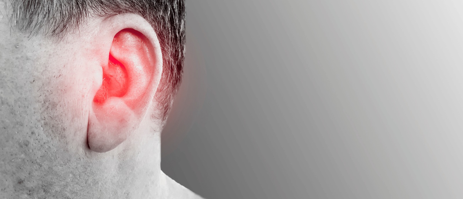 Person using a hearing aid to manage milder hearing loss | Aanvii Hearing
